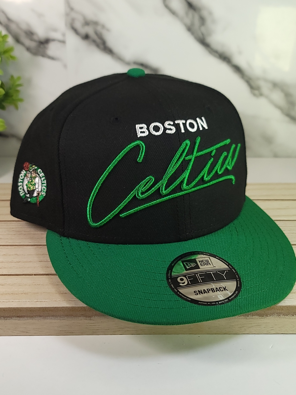 New Era Boston Celtics Black & Green Snapback Hat. Adjustable